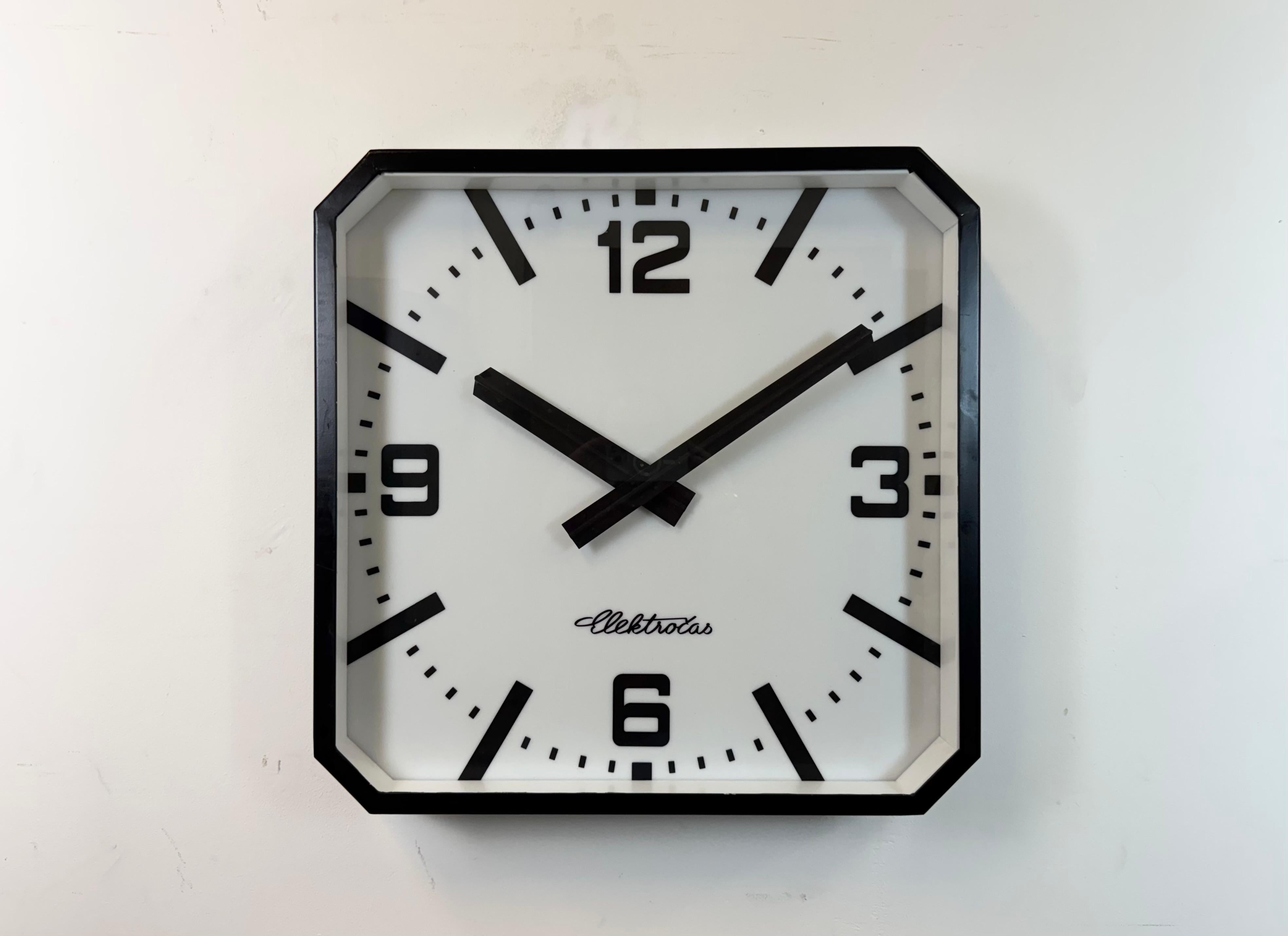 This wall clock was produced by Elektročas ( former Pragotron ) in Czech Republic during the 1990s - 2000s It features a black metal frame, a plastic dial, an aluminium hands and a clear glass cover. The piece has been converted into a