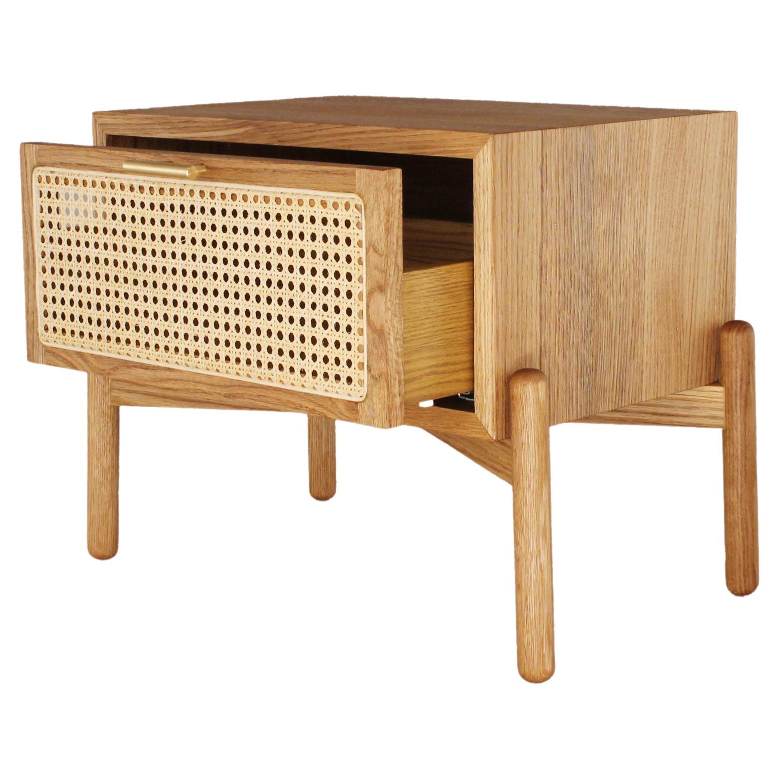 The Dumas nightstand is manufactured in solid white oak with a wicker drawer. The wicker caning and the carpentry are made by Mexican craftsmen. This bedside table is a contemporary Mexican piece and was originally designed for small