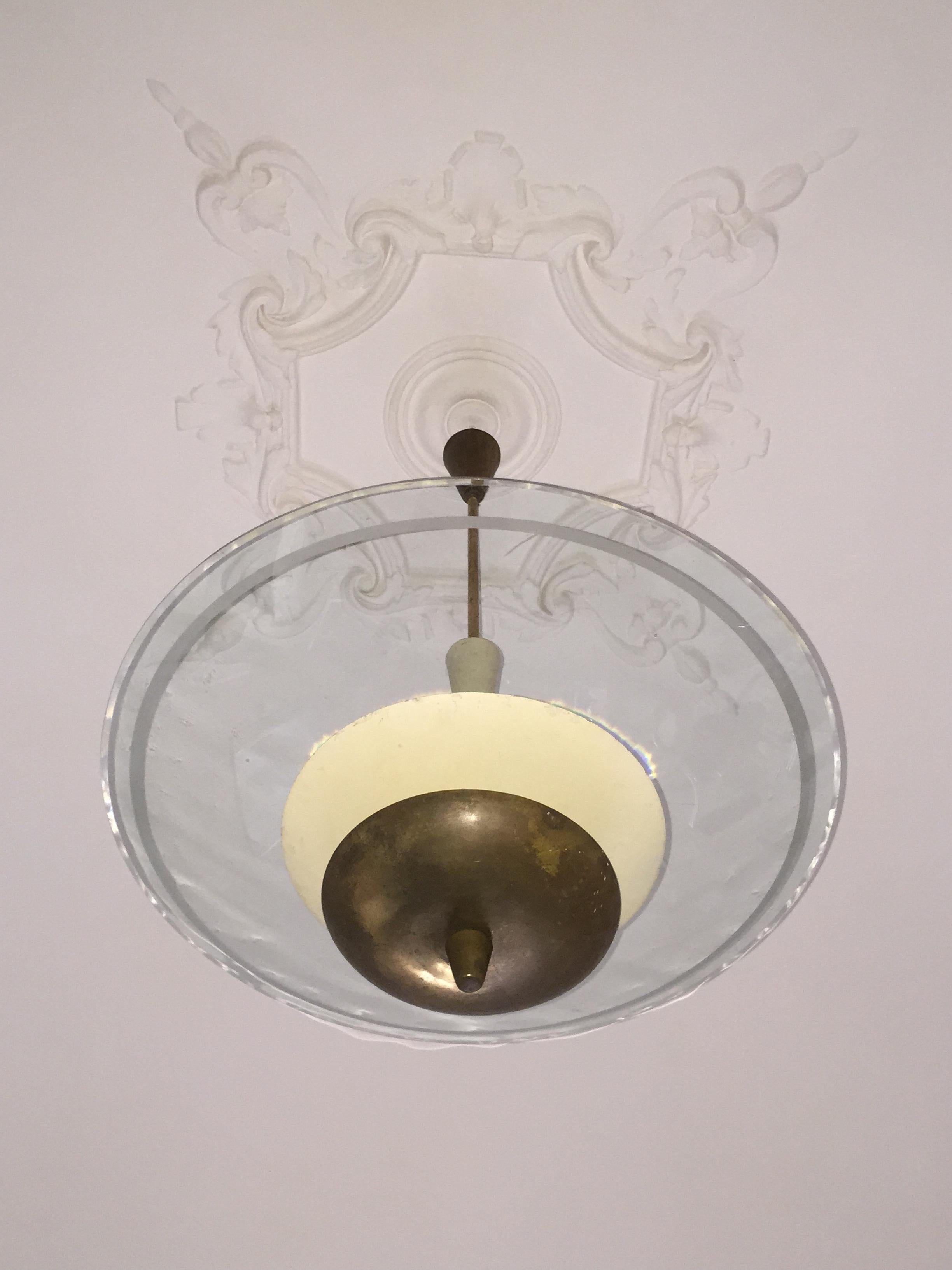 Italian Fontana Arte chandelier from 1950. Curved glass, brass and lacquer. Diameter about 70 cm. Height 110 cm.