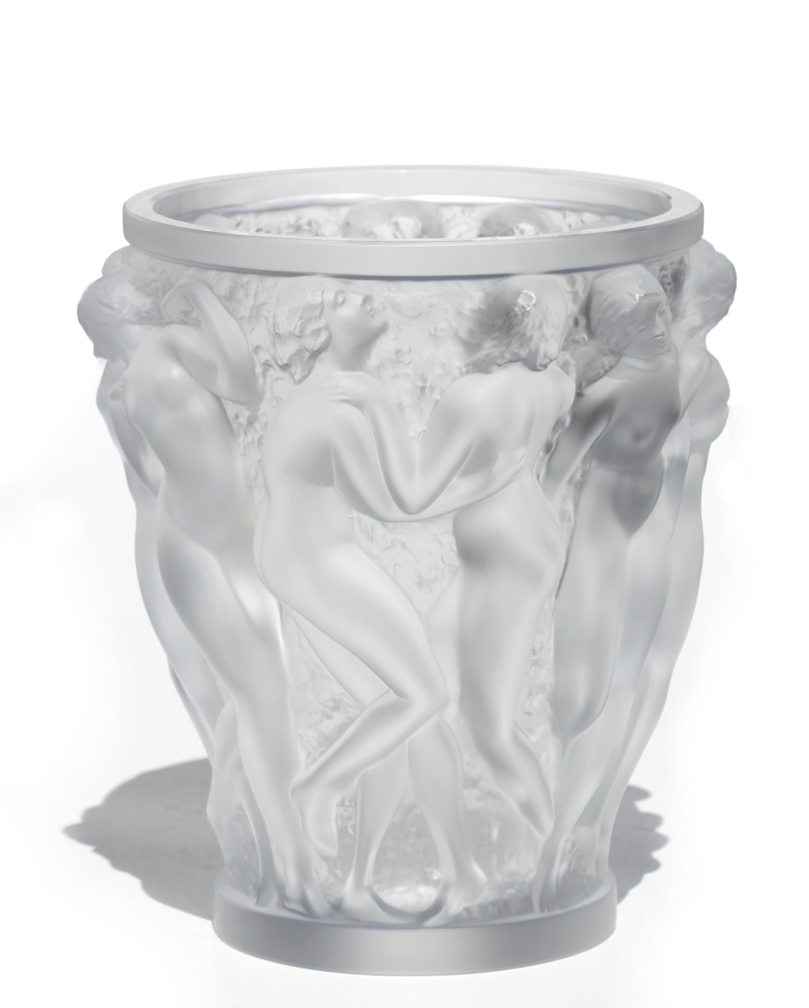
Lalique France, “Bacchantes” Frosted Crystal Vase
Late 20th Century
The iconic “Bacchantes” vase by Lalique, finely executed in clear and frosted crystal, depicting a continuous frieze of nude female figures in high relief, dancing amidst vines and