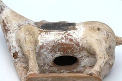 An antique chinese terracotta horse sculpture