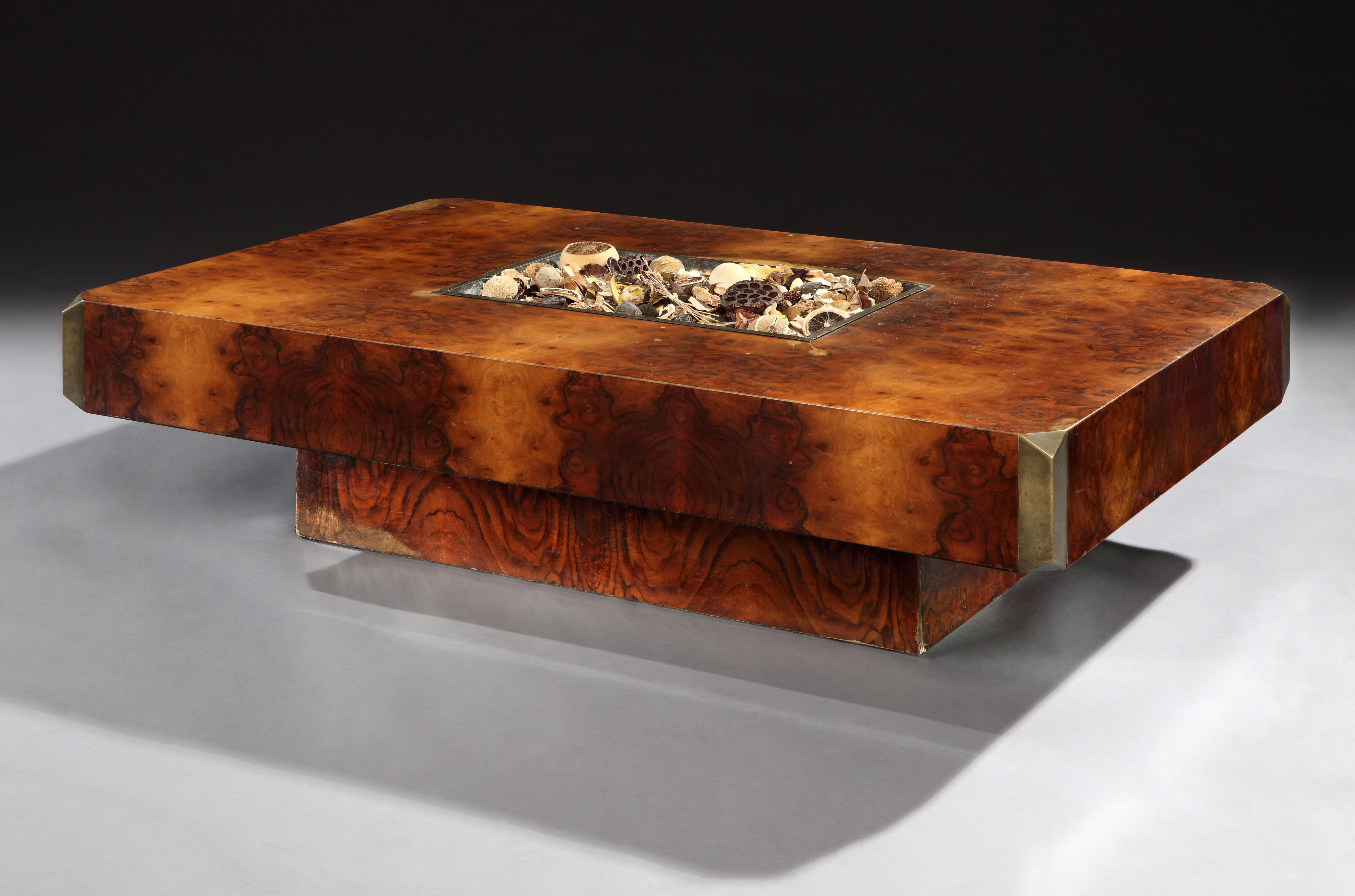 This is a rare edition of the Alveo (riverbed) coffee table, retailed by Mario Sabot in Italy from 1972. 
 
 The table is veneered in burr Thuya which is sought after for its beautiful figuring. The top has an inset brass-lined well. This may have