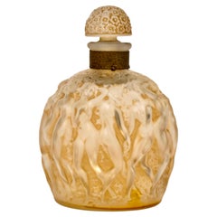 1937 Flacone di profumo di René Lalique "Calendal" in vetro Molinard con patina color seppia e figure di baccanti