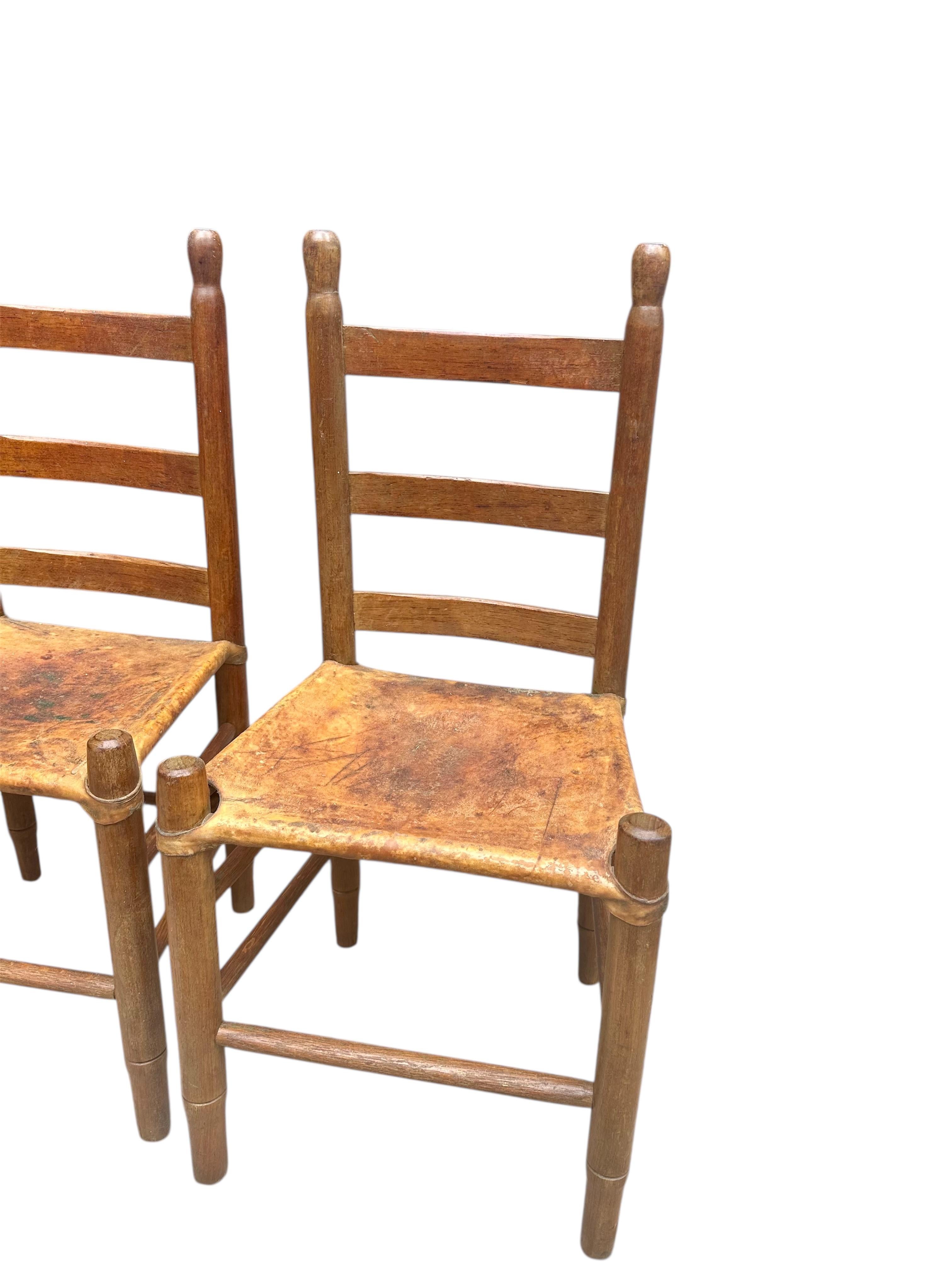 Set of Four Early 20th Century American Ladder-Back Wood and Deer Hide Chairs. For Sale 2