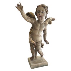 Putto in legno intagliato, policromo e parzialmente dorato, in stile barocco bavarese del XVIII secolo