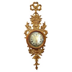 Horloge murale néoclassique italienne du milieu du siècle, en bois doré, signée Palladio.