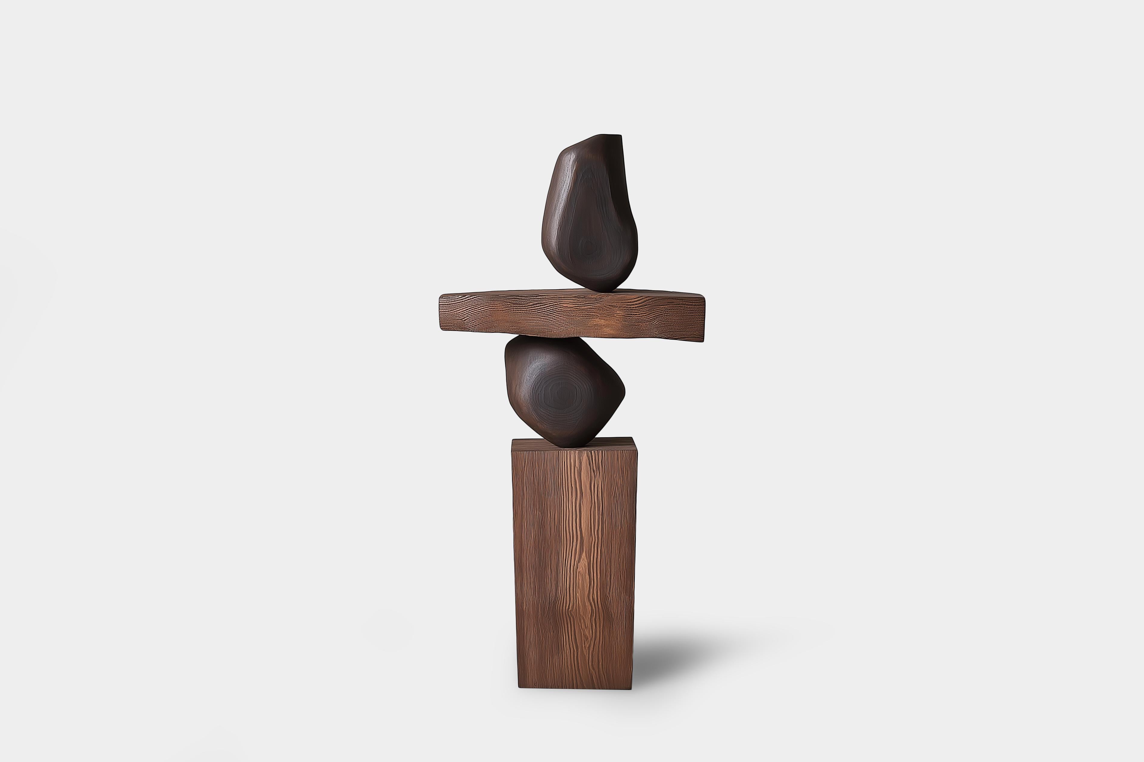 Lull No128 Sculpture géométrique en bois de Joel Escalona - Une pièce d'art moderne
---
L'équilibre et la tension sont au cœur de ces sculptures. Le jeu entre les formes lisses et arrondies et les bases solides et angulaires crée un équilibre