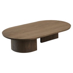 Mesa de centro ovalada «Fundamenta 11 Big» de madera maciza oscura, de Nono