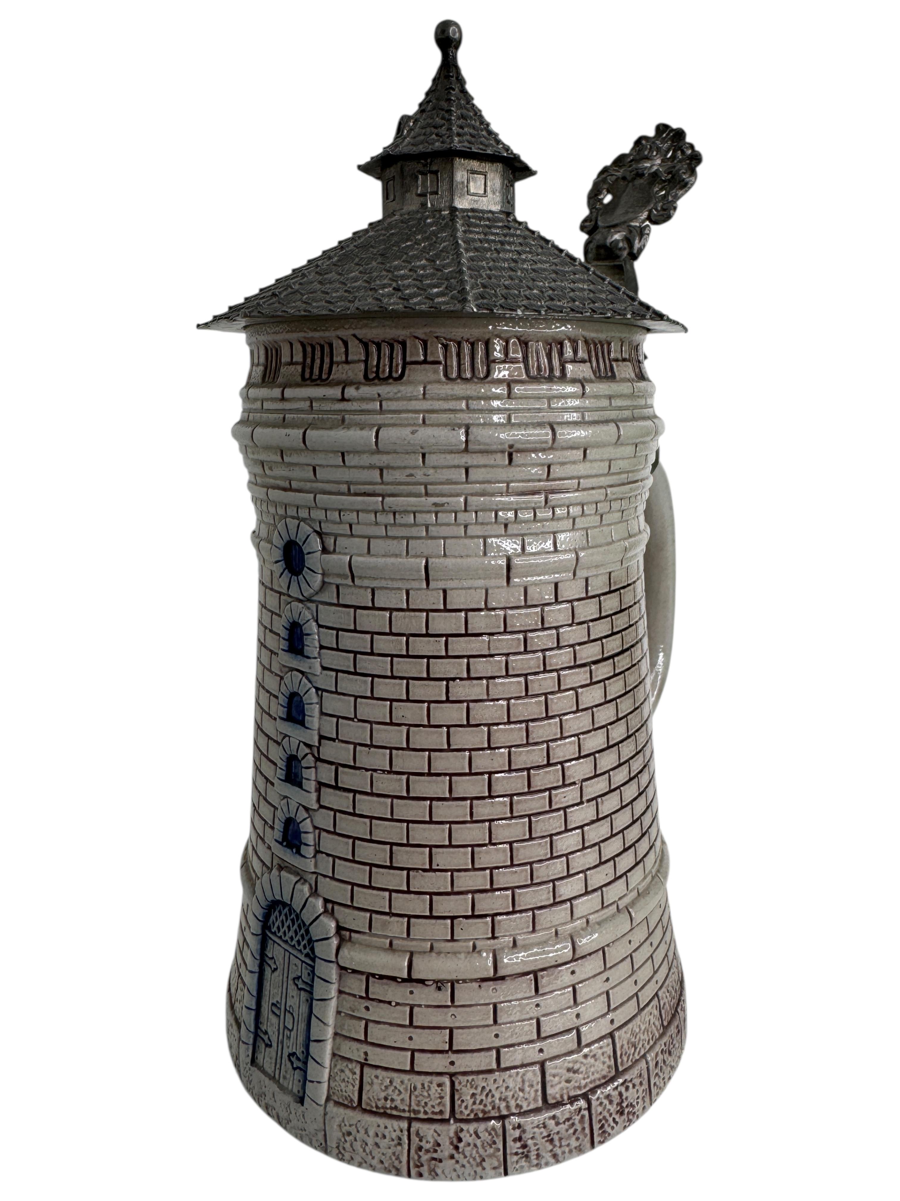 Antique tower-shaped beer stein by Theodor Wieseler, it served as a prototype for one of the towers of Nuremberg Castle; German, late 19th century, with blue-violet salt glaze and a detailed pewter lid with thumb rest. Inscribed 