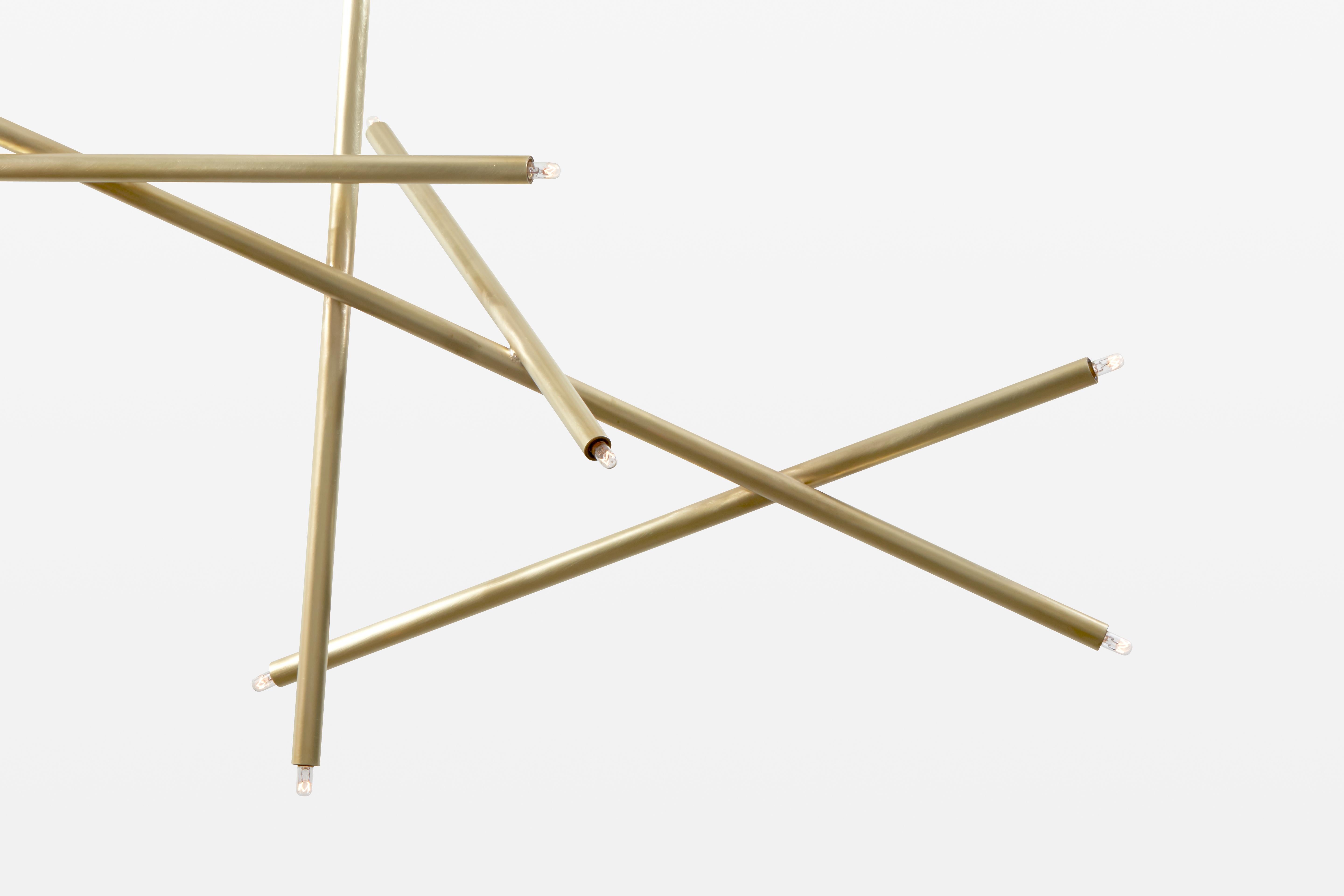 Measurements: 47 W x 22 D x 36 H inches
Drop length: 36 inches.
Canopy: 6 W x .25 H inches.
Shown in brushed brass.

The Pick Up Stick collection presents a playful contrast to formality, breaking up the clean lines of modern space by adding