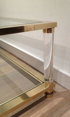 Large lucite and brass coffee table. French work. Circa 1970