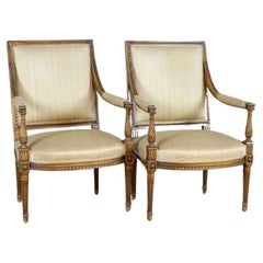 Deux fauteuils de salon Louis XVI vers 1930