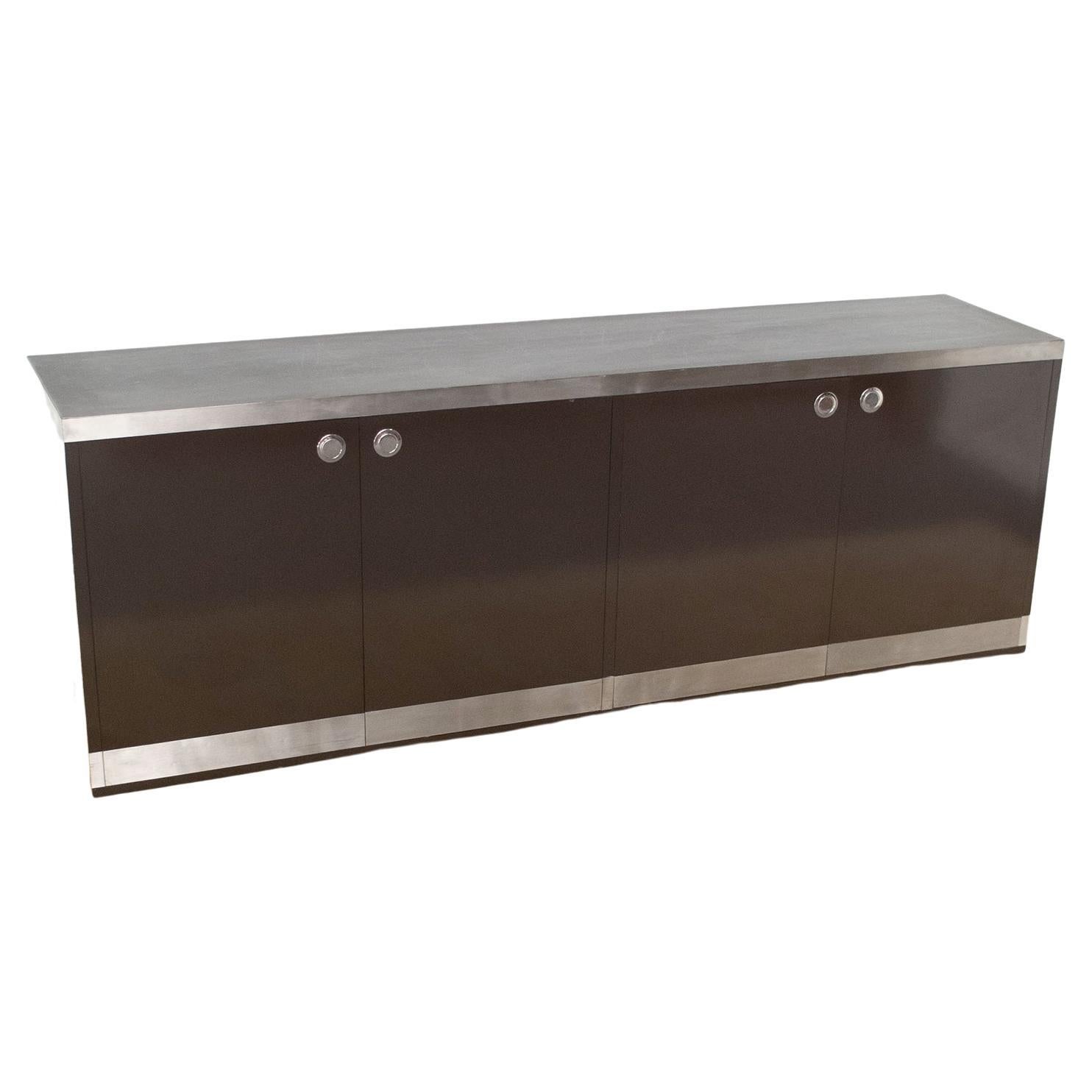 Sideboard in glossy brown lacquered wood with four doors with four drawers, steel handles with satin aluminum edges designer Willy Rizzo for Sabot Italia.