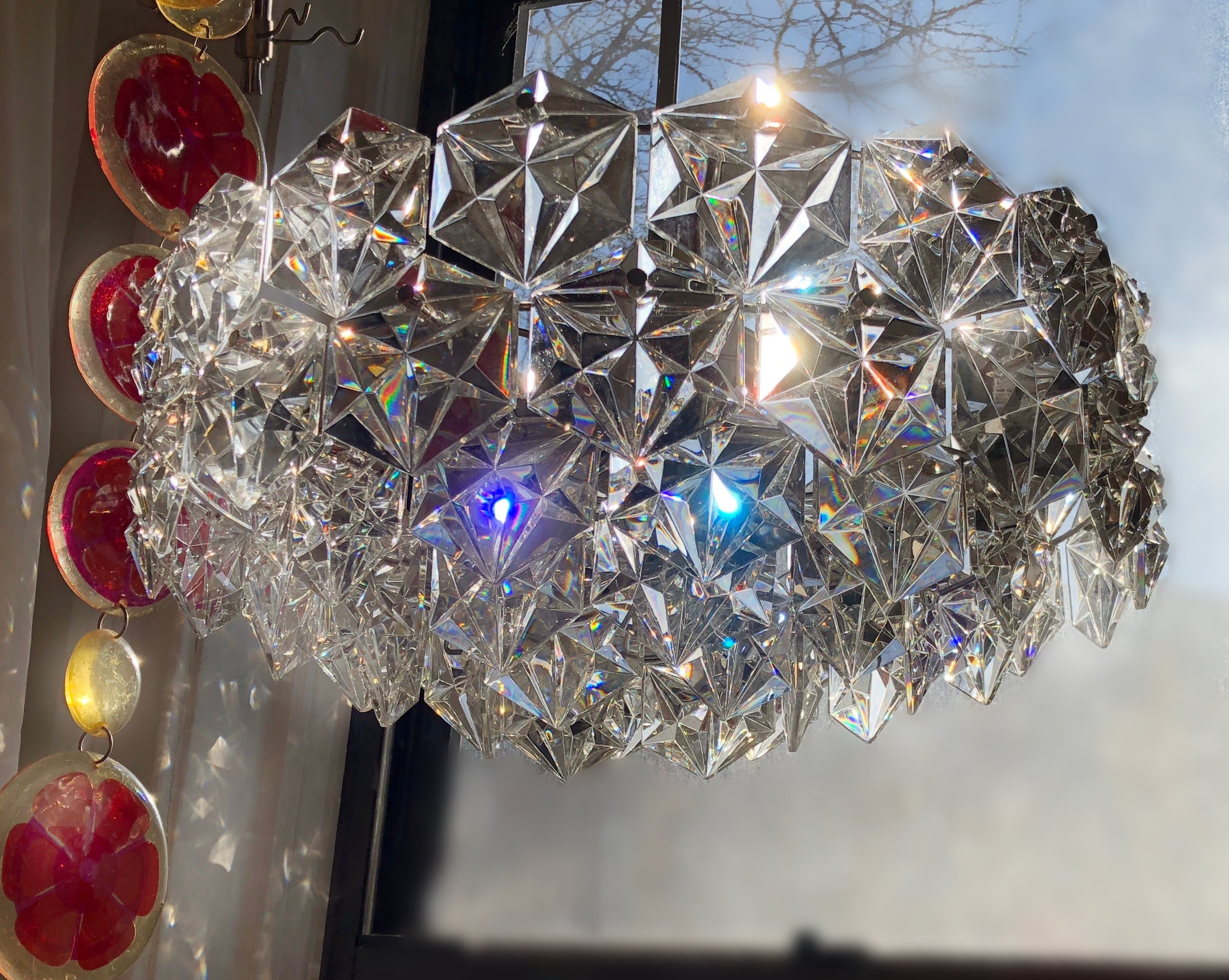 Gorgeous (rare) silver tone example of the iconic faceted crystal chandelier design by Kinkeldey Germany, circa 1965. The aesthetic is elevated to a certain unassuming modernity and understated quality. Stunning.
Good vintage condition. A few flea