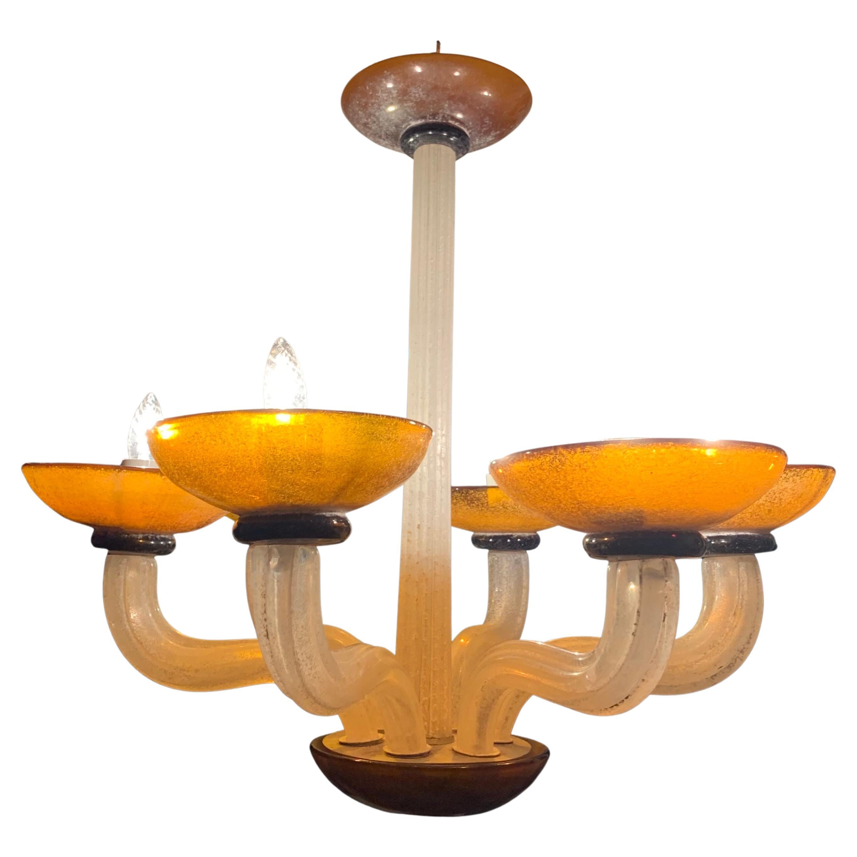 Karl Springer Seguso fluted cream and amber scavo murano glass chandelier, 1980s.
 Murano glass design by Karl Springer, manufactured by Seguso Vetri d’Arte, Italy.
Neoclassical Revival Postmodernism of the early 1980s. Fluted columnar central axis