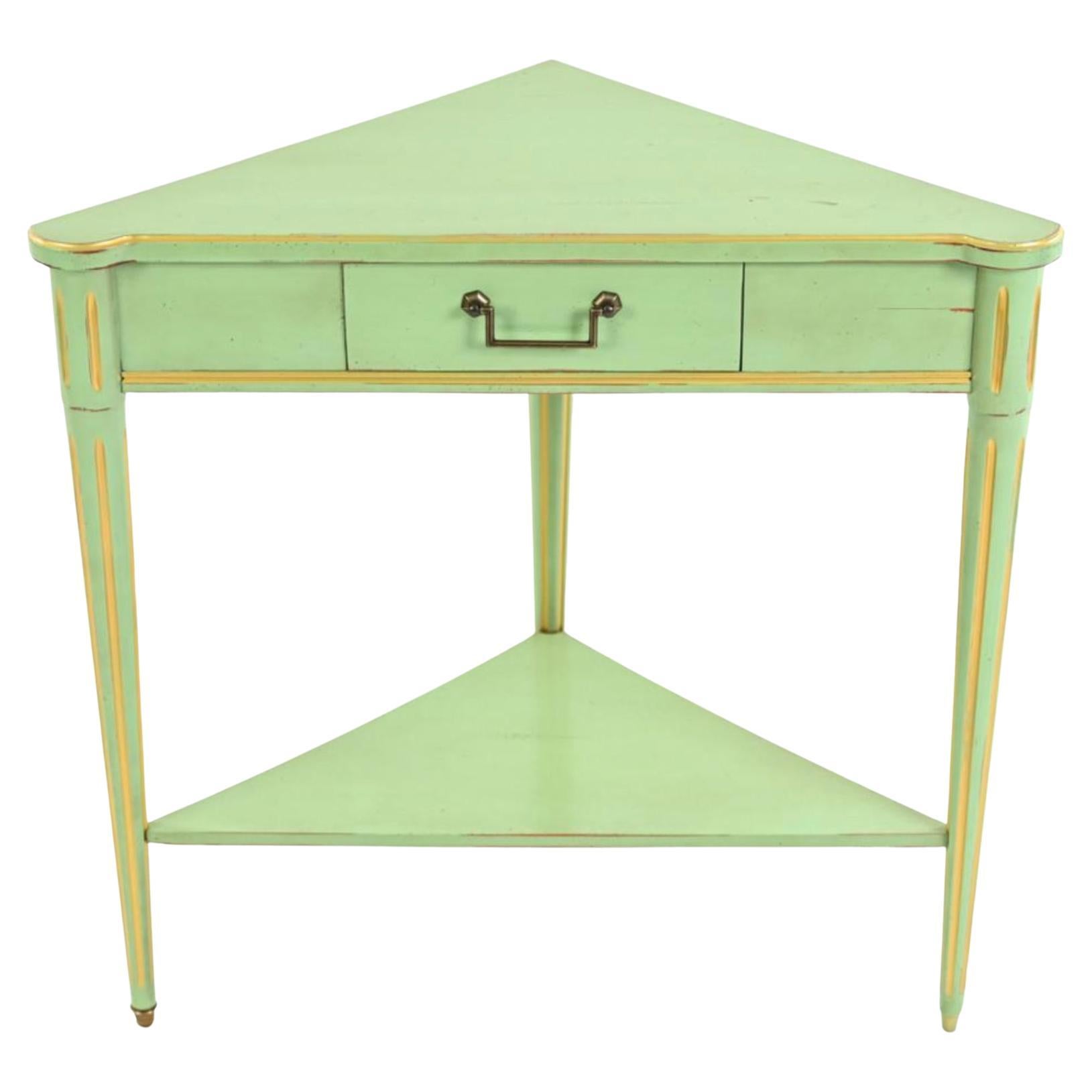 French provincial custom green grange triangular table, corner console, France.  French corner table painted green with gold leaf striping, tapered and fluted legs, single drawer with squared bale handle. Dimensions: H 29.25