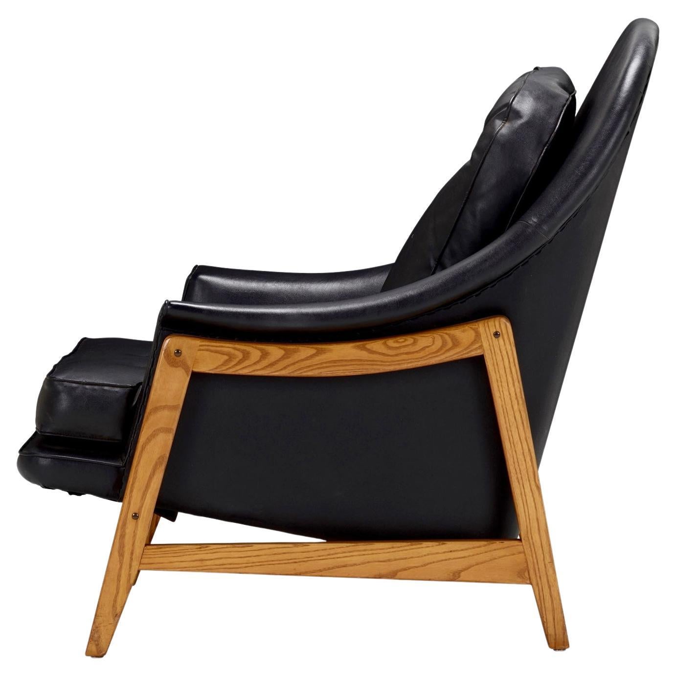 Edward Wormley black leather Janus lounge ch air, Model 5701, Dunbar, 1957
ash, leather; 33.75 H × 30.5 W × 34 D in; Stitched manufacturer's mark to decking 'Dunbar'. Upholstery manufacturer's label to seat 'Edward Wormley for Dunbar Furniture