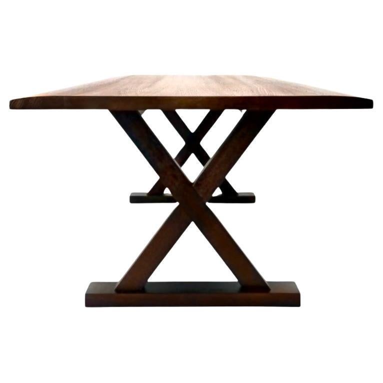 Christian Liaigre Courier dining table, Oak, Holly Hunt, France, 2017. 100” x 42” x 29.5” H. This table was initially designed by Christian Liaigre for his house in Ile de Ré… a rustic house in harmony with the environment, whilst remaining