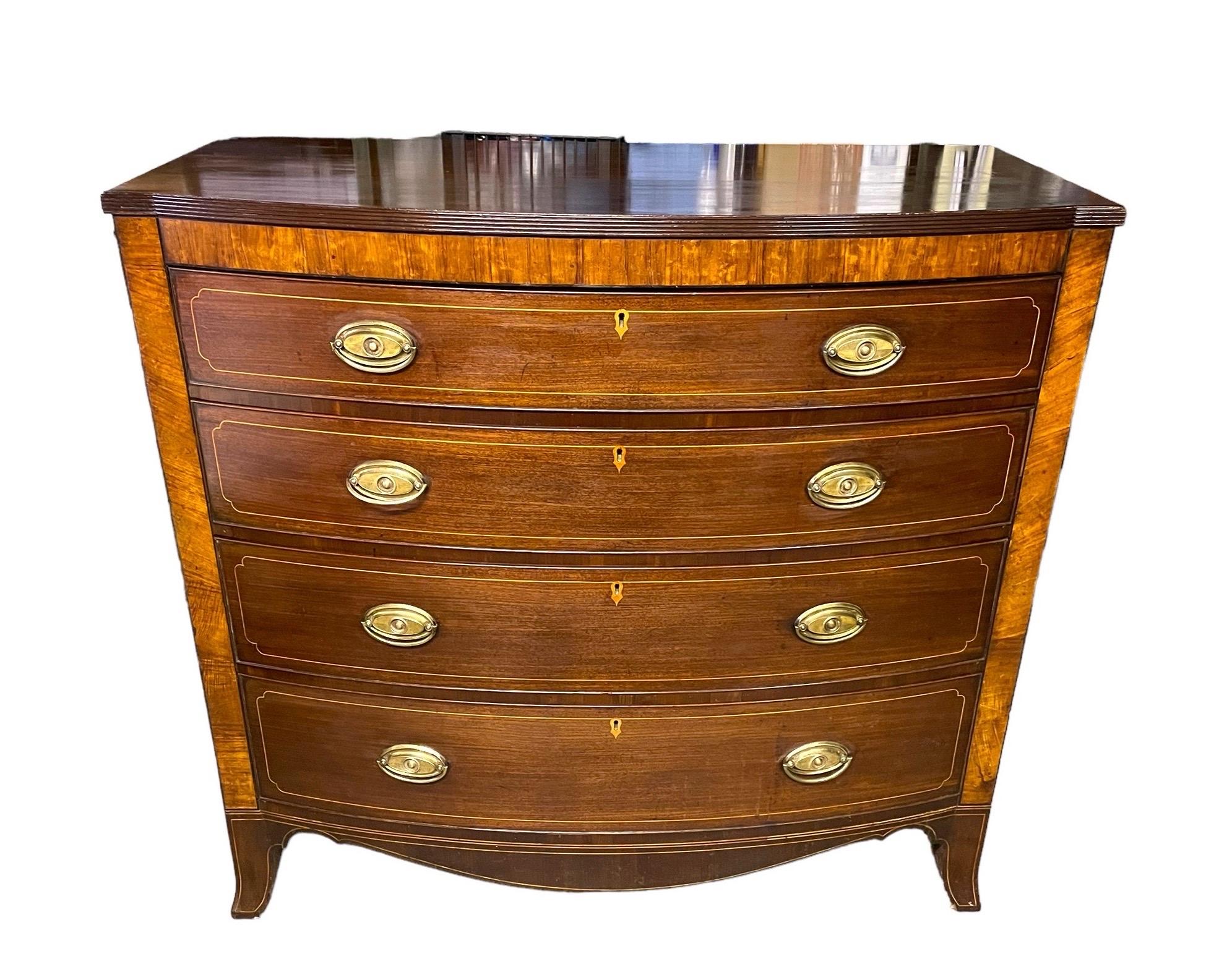 A finely drawn chest of drawers with four long drawers, the top one with a double divider, the drawer fronts are lined in boxwood and set with a quality inlaid escutcheon, the chest all supported on fine design splay feet, the piece is in good