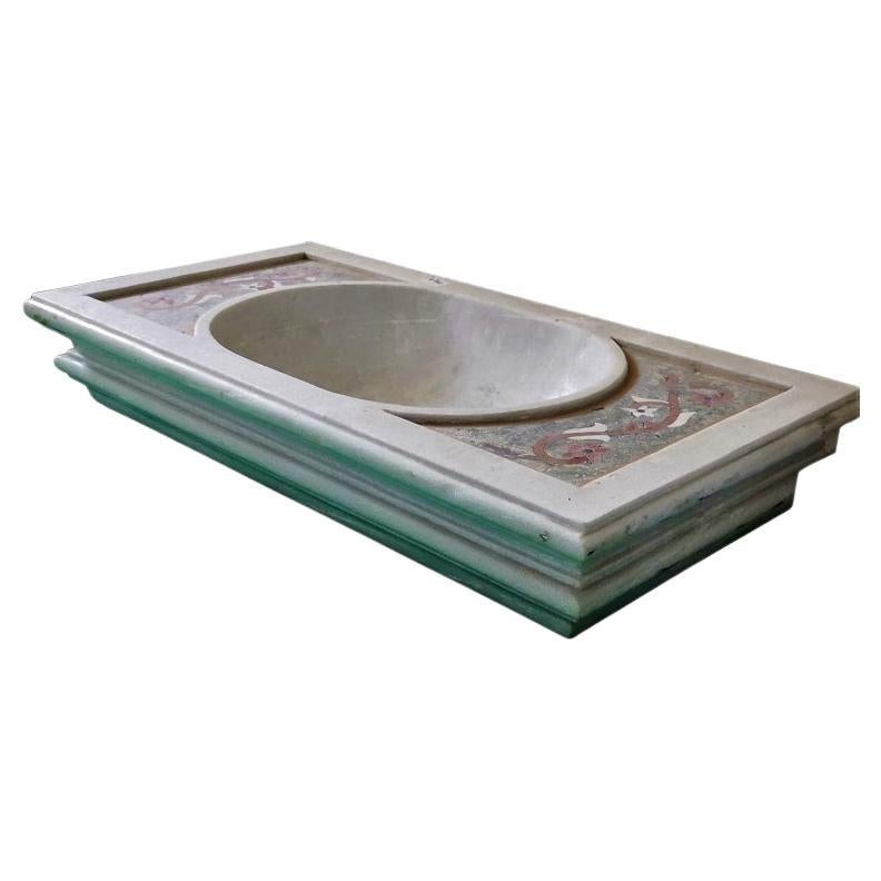 This timeless beautiful Italian classical sink is cut from one single block of white marble with polychrome inlays.
These designs have not changed since Greek and Roman times and carry superb artistic merit easily fitting in with old and new