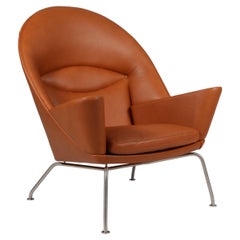 Fauteuil « Oculus » de Hans J. Wegner, en cuir de noyer pleine fleur