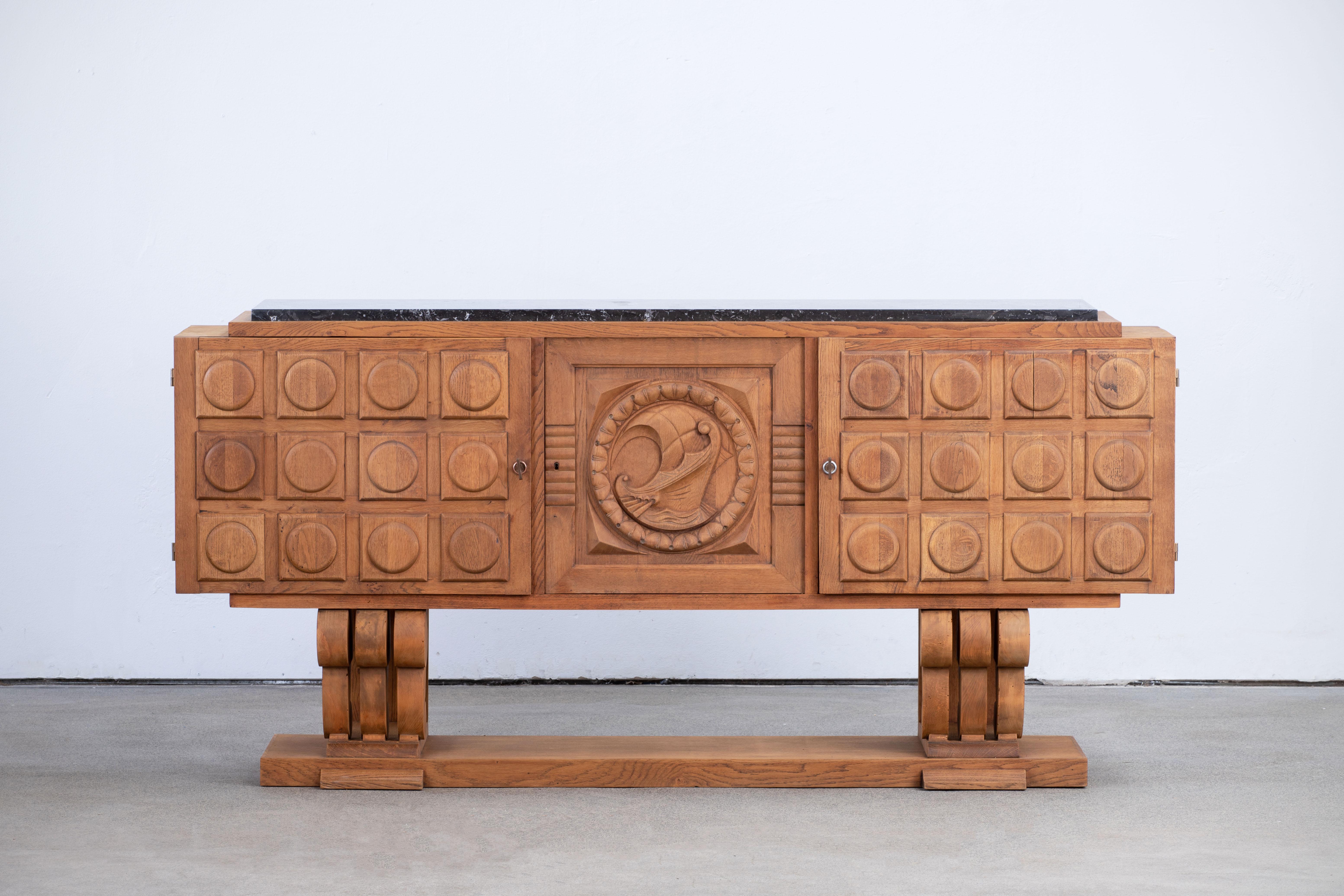 A composition of resolute presence, this French credenza reveals a language of sculptural gravity and geometric poise. Executed in solid oak, it hails from the 1940s—a decade when French cabinetmakers reasserted the primacy of material and structure