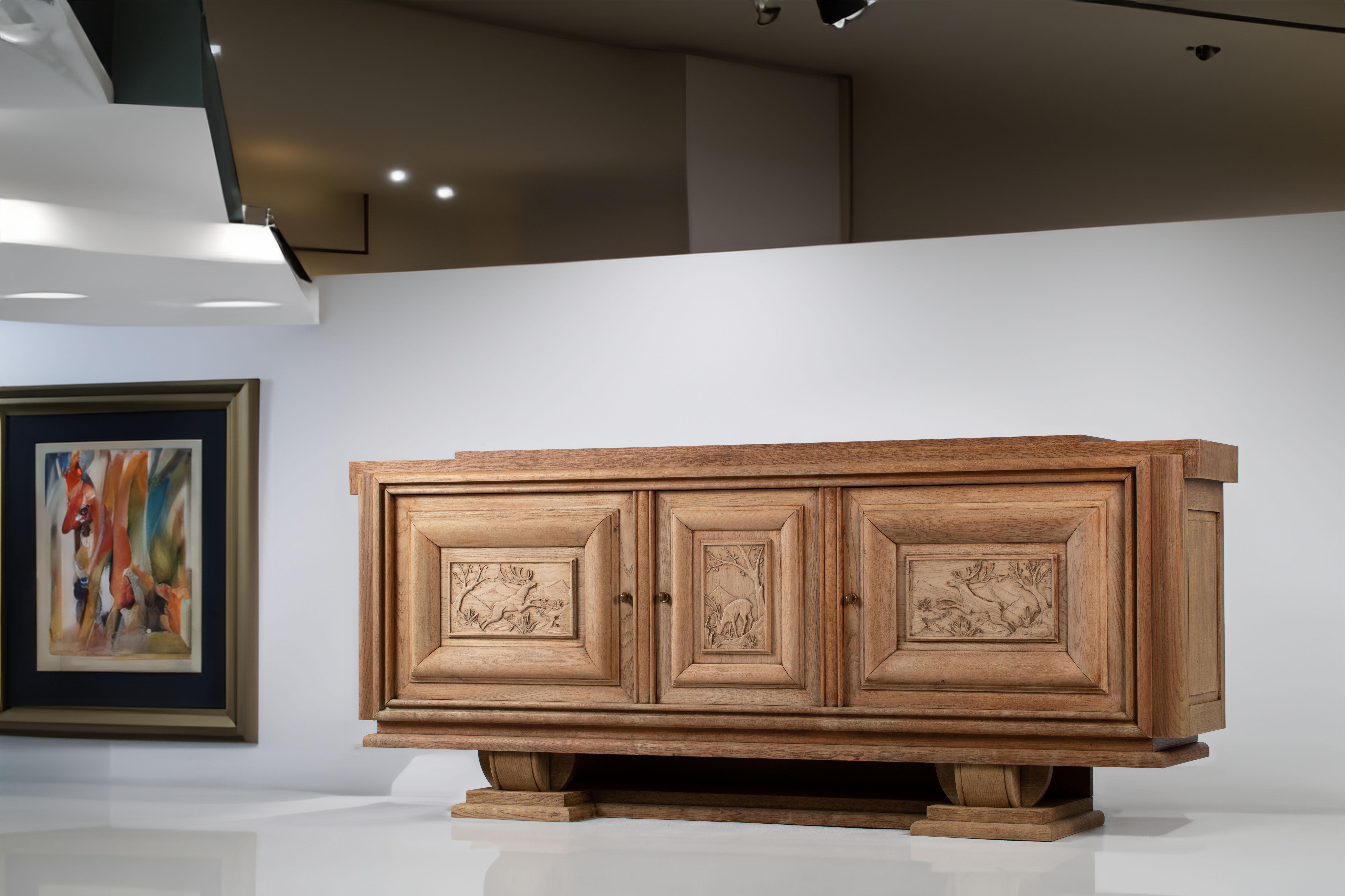 A composition of solemn refinement, this French sideboard from the 1940s articulates a language of sculptural quietude and regional memory. Framed in a disciplined rectilinear silhouette, the piece is defined not by embellishment but by the quiet