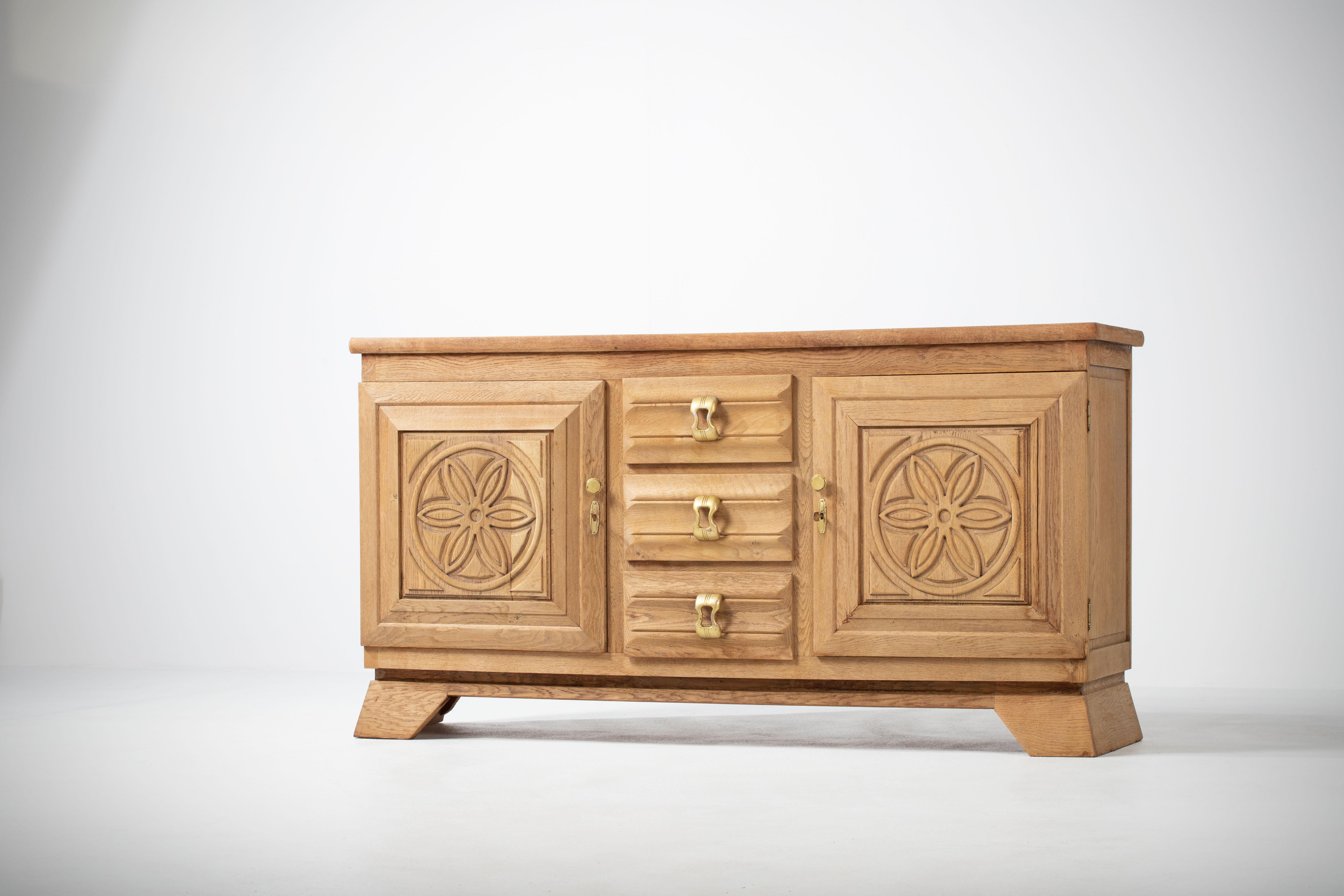 A composition of stoic clarity, this Breton sideboard unearthed in Normandy reveals a language of sculptural restraint softened by regional tradition. Executed in solid oak, the piece commands presence not through embellishment but through the