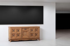 Oak Sideboard with Figural Metal Reliefs and Gilt Mount, France, 1940s