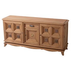 Oak Sideboard with Figural Metal Reliefs and Gilt Mount, France, 1940s