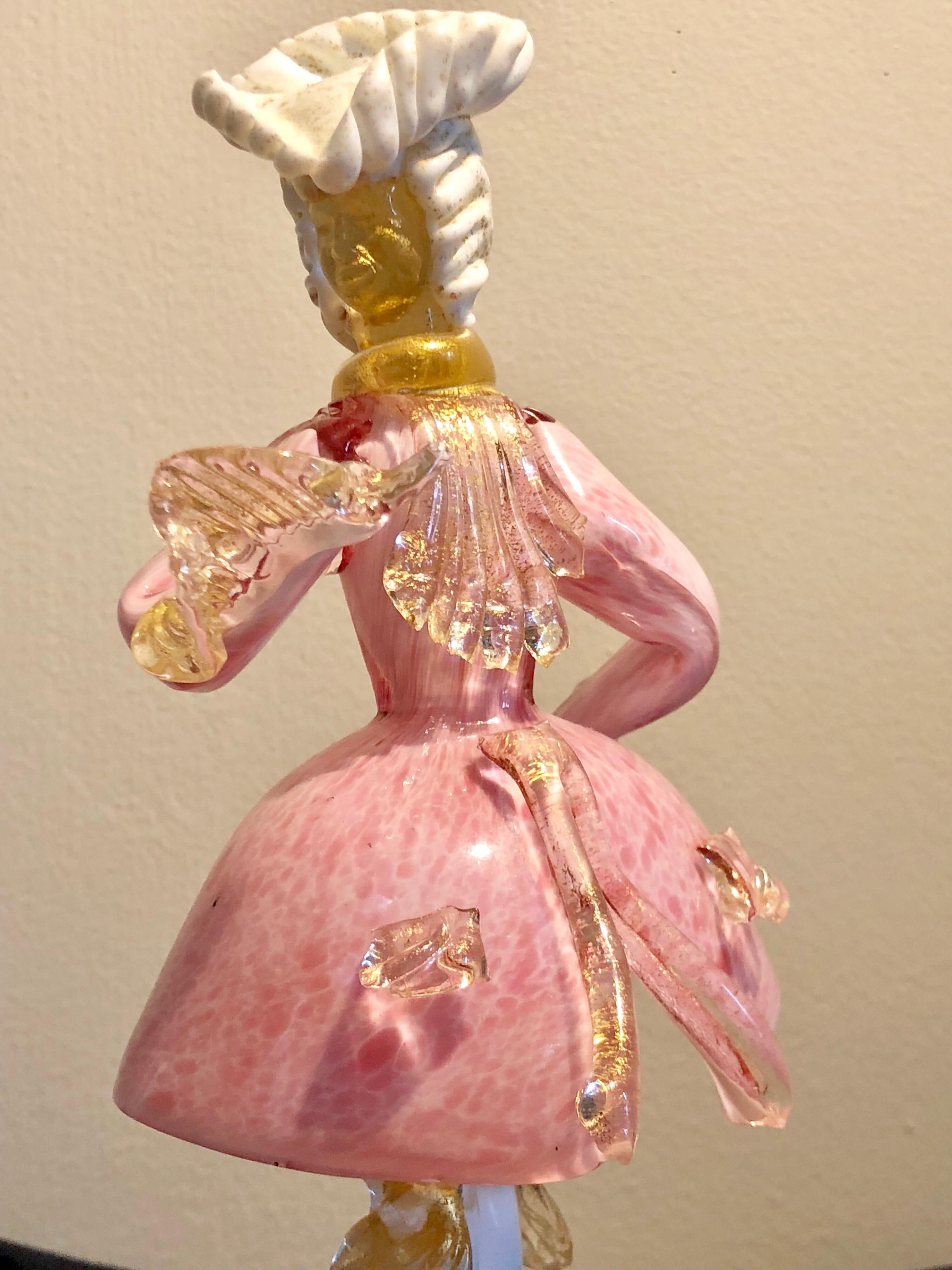 Venetian Murano mid-20th century standing figure of gentleman attired in 18th century style costume
Rose pink and milk glass with speckled gold detail.