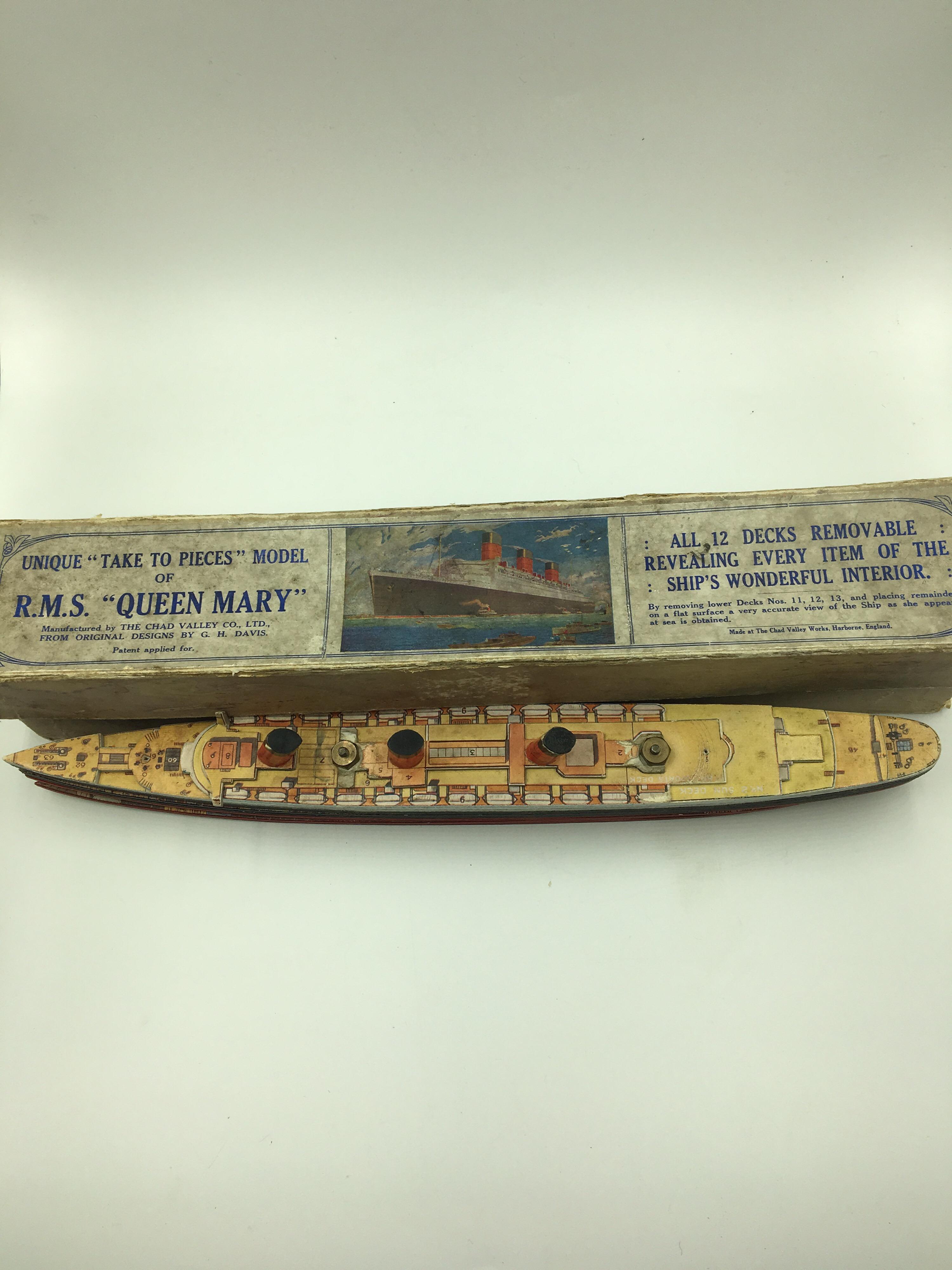 Very rare old 'take to pieces' model of R.M.S. QUEEN MARY.
It dates to 1936 and was made by Chad Valley, Harborne, England.
It features 12 removable decks and it comes in its original box with its original key chart.