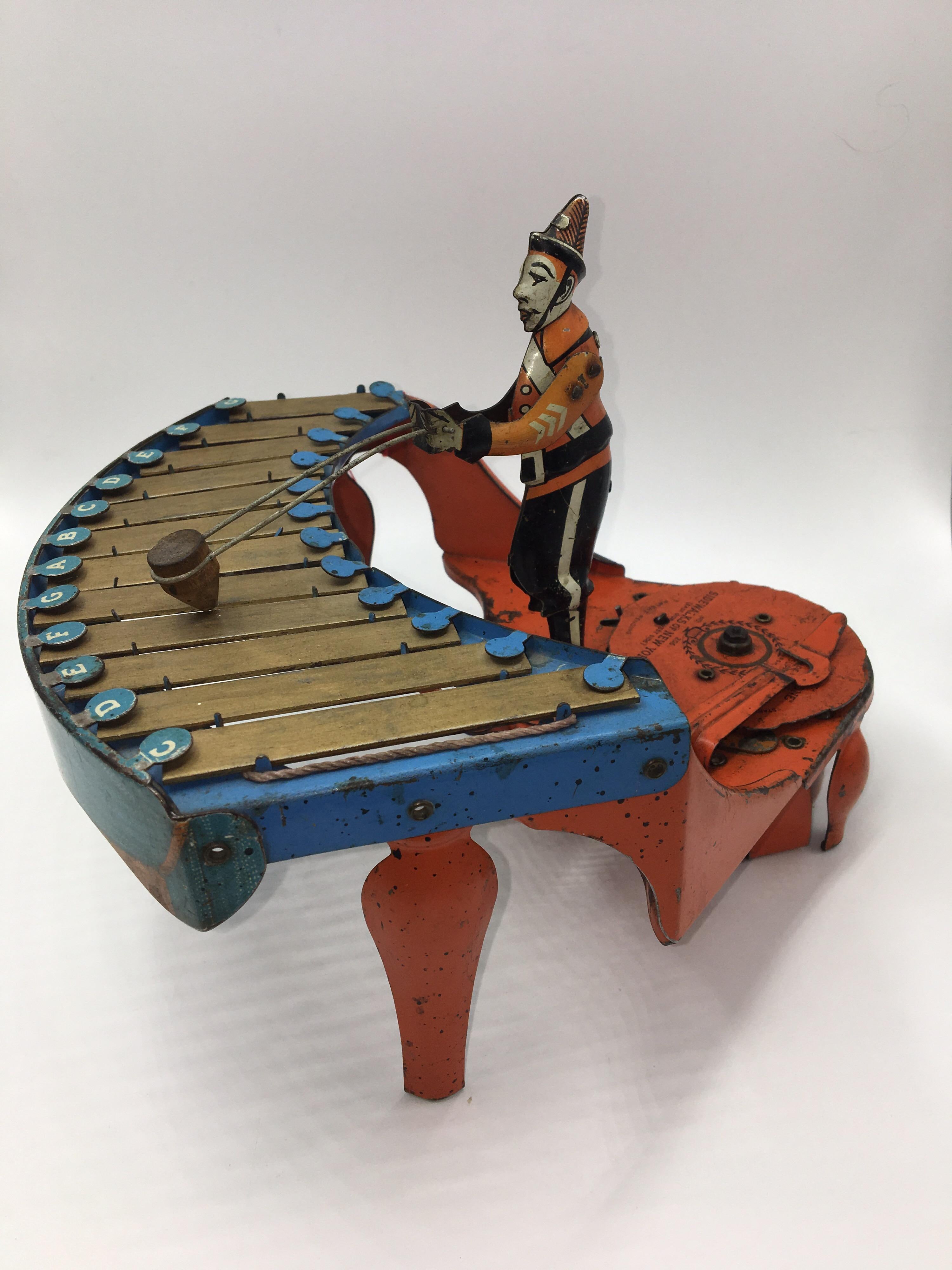 Rare vintage 1930s No. 48 Zilotone Windup tin toy made by Wolverine Supply & Mfg. Company, Pittsburgh, PA,
circa 1930s; pressed steel and tin toy.
Great example to add to your vintage wind-up toy collection!