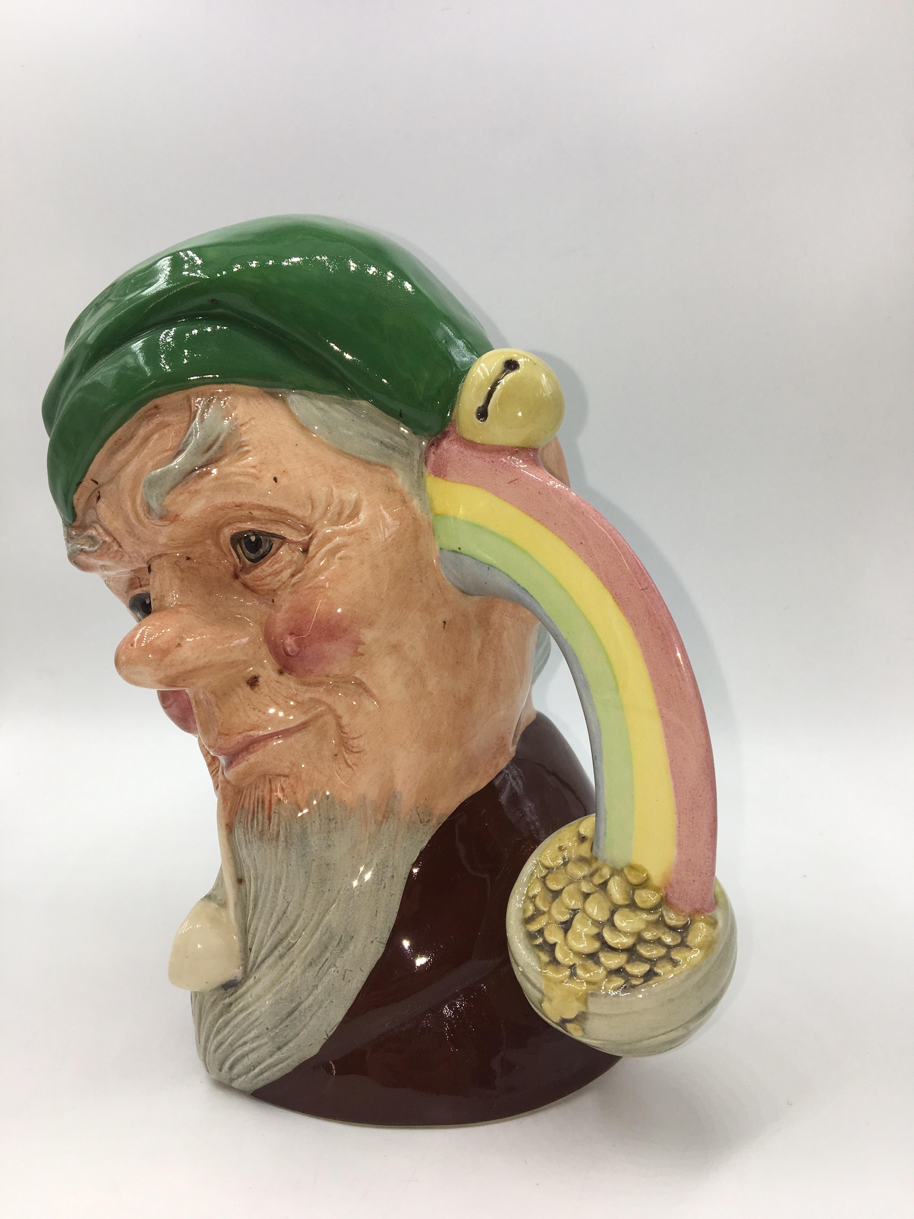 Royal Doulton character jug Leprechaun d6847, 1989 
Excellent condition. 
The wizened little elf is a legendary Irish sprite with a mischievous nature. The Irish believed that leprechauns guarded hoards of treasure hidden at the end of rainbows.