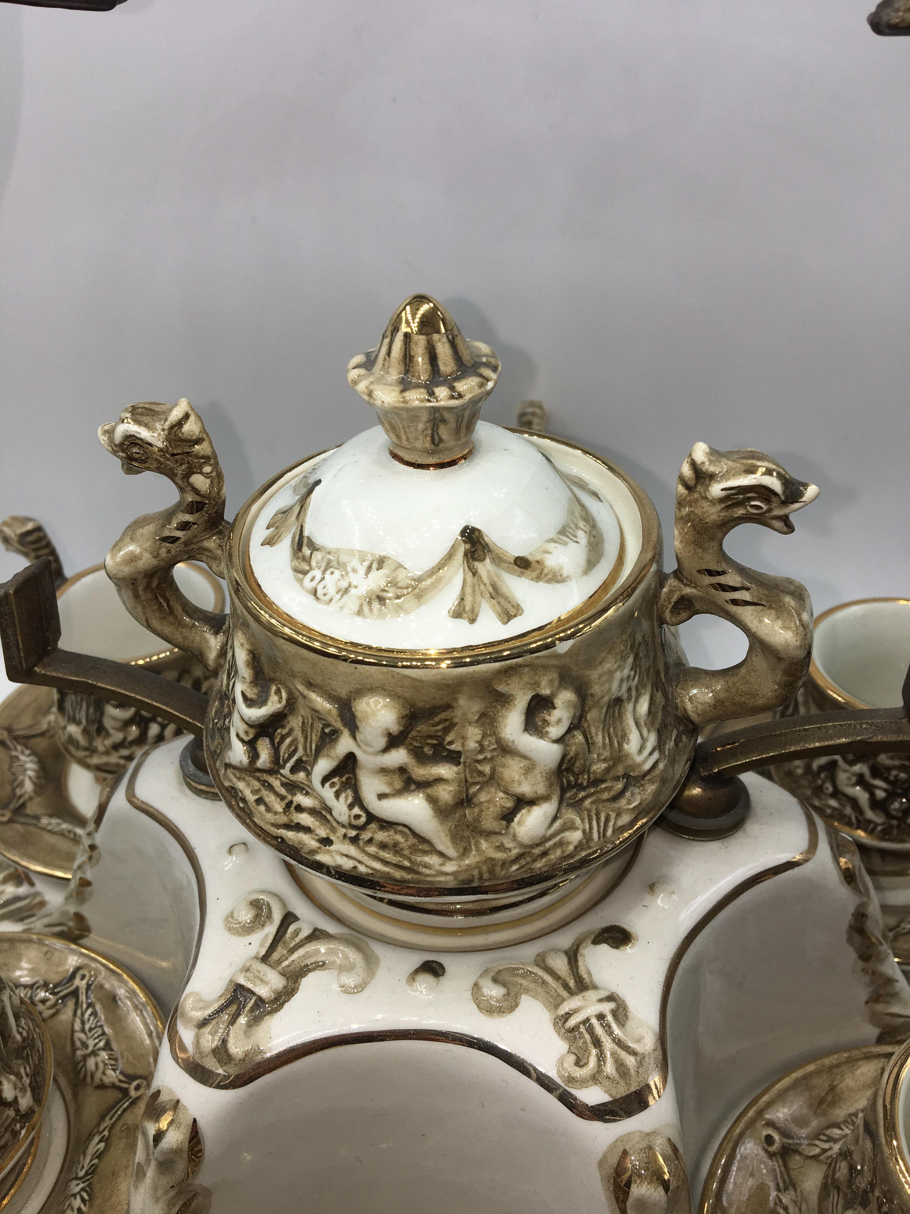 Beautiful vintage coffee service Capodimonte porcelain demitasse, 1950s.
The service consists of 6 cups and sugar bowl, all on a tray with brass handle.
Each piece has the mark of originality.