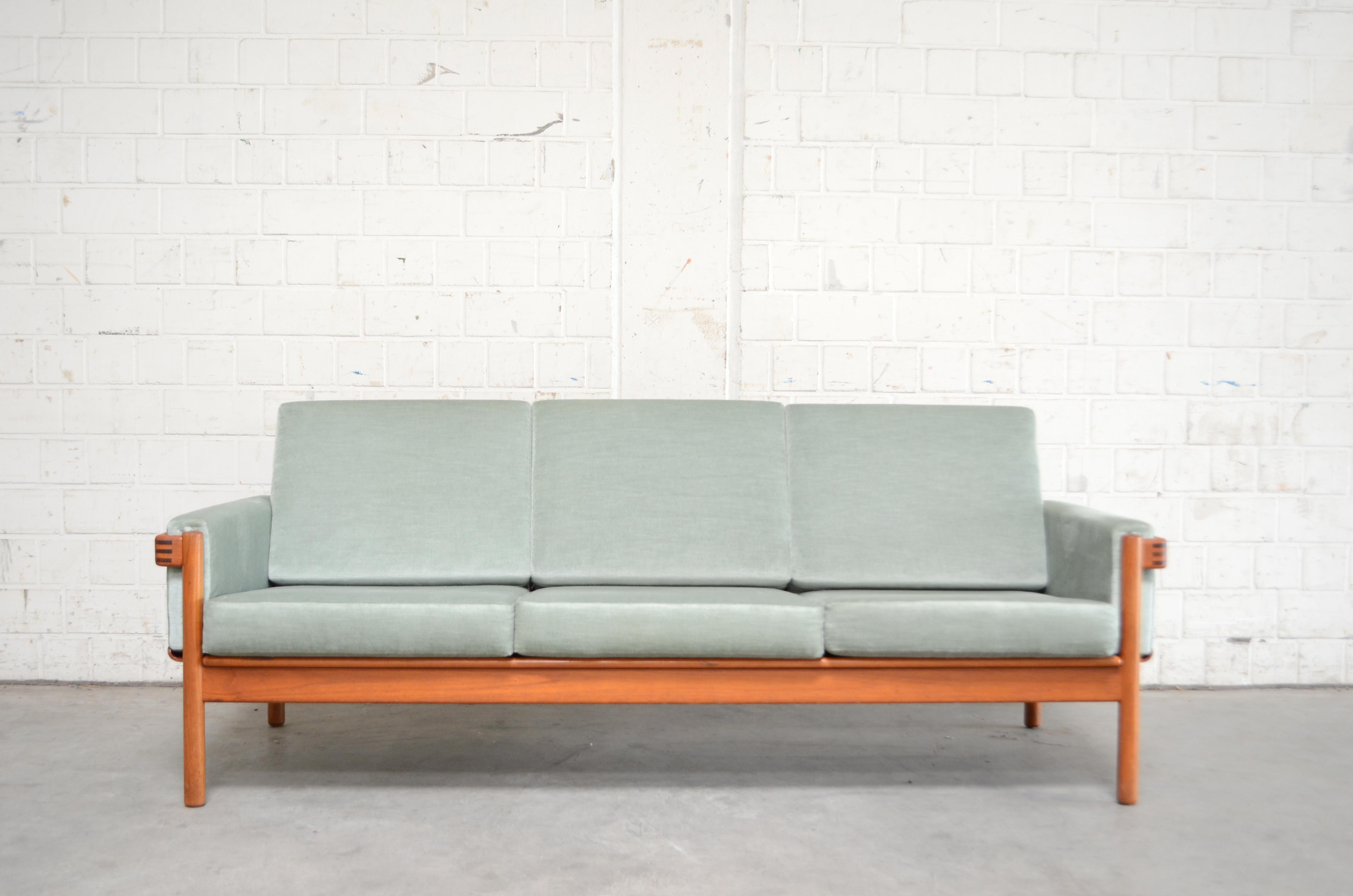 Danish modern sofa and 2 armchairs designed by Henry Walter Klein for Bramin.
The frame is made of solid teak wood and has nice details.
The cushions are renewed some years ago in velour fabric pastel color.
This model from Henry Walter Klein is