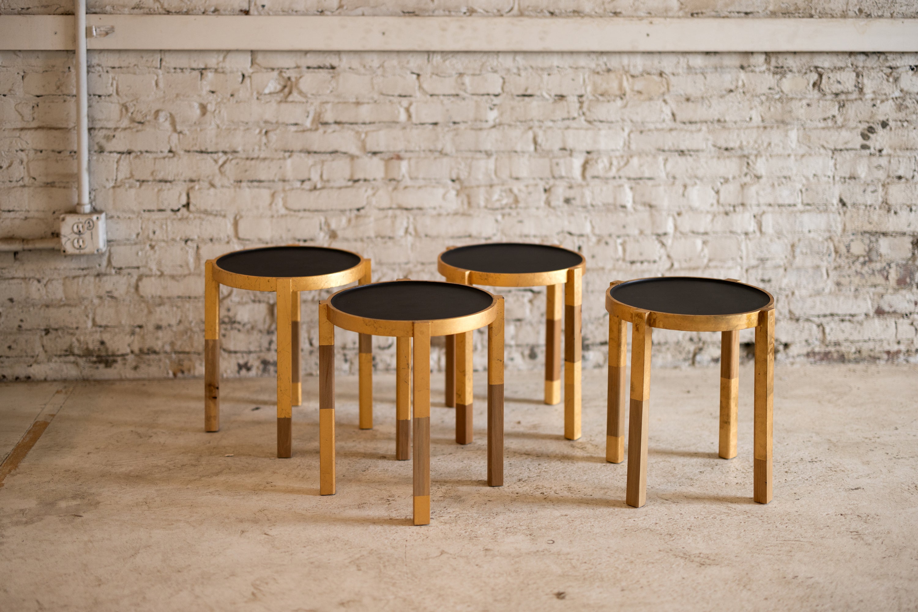 Small Matte Black, Gold Leaf and Wood make this unique small batch of Waverly side tables. Small, round, lightweight with curves you want to touch, this versatile end table is made of the finest repurposed urban timber. A natural wood finish on