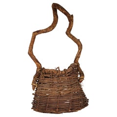 Panier Ikebana vintage en rotin et racine torsadée tissée