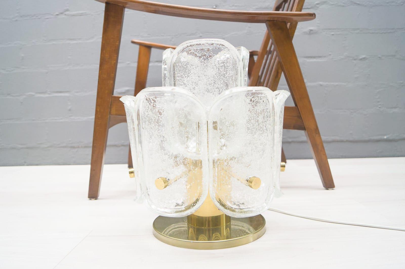 This lamp was manufactured in Germany during the 1960s. It features nine heavy ice glass elements and has 1 E27 socket. In good condition with typical brass patina.