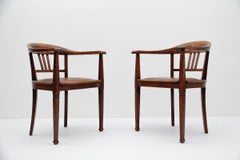 A pair of Art Deco armchairs made in wood and leather, 1930s Germany