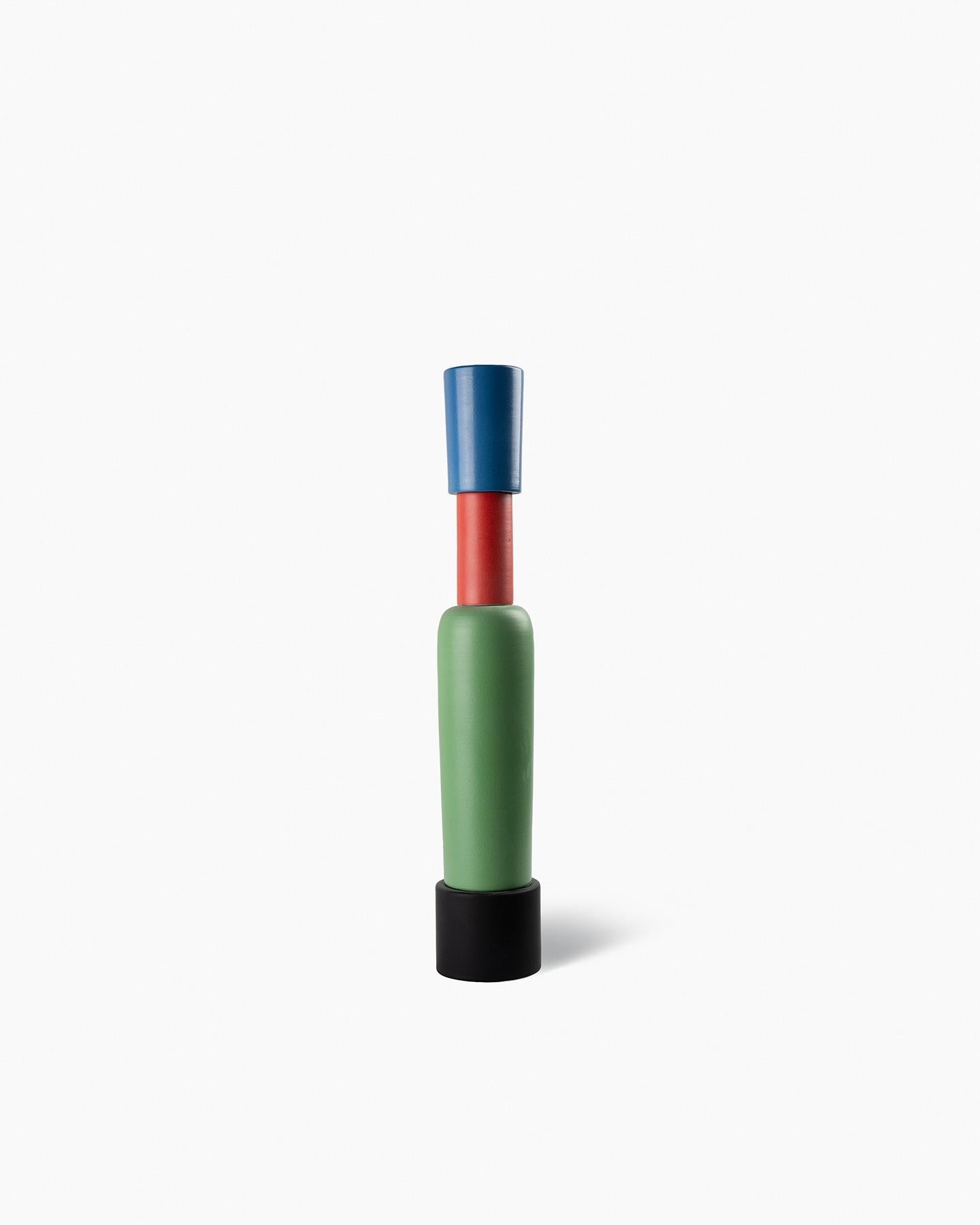 Nathalie Du Pasquier designed a collection
of three vases for Bitossi, in 2004. The
vases are bottle‑shaped and composed
of stackable elements. The formal and
chromatic research is closely linked to her
painting. Using the lathe technique, the
vases