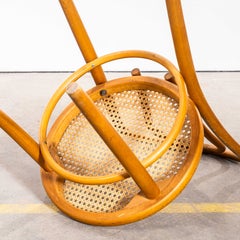 Ensemble de quatre chaises « Hoopbacks » blondes d'origine des années 1960, avec assise en rotin