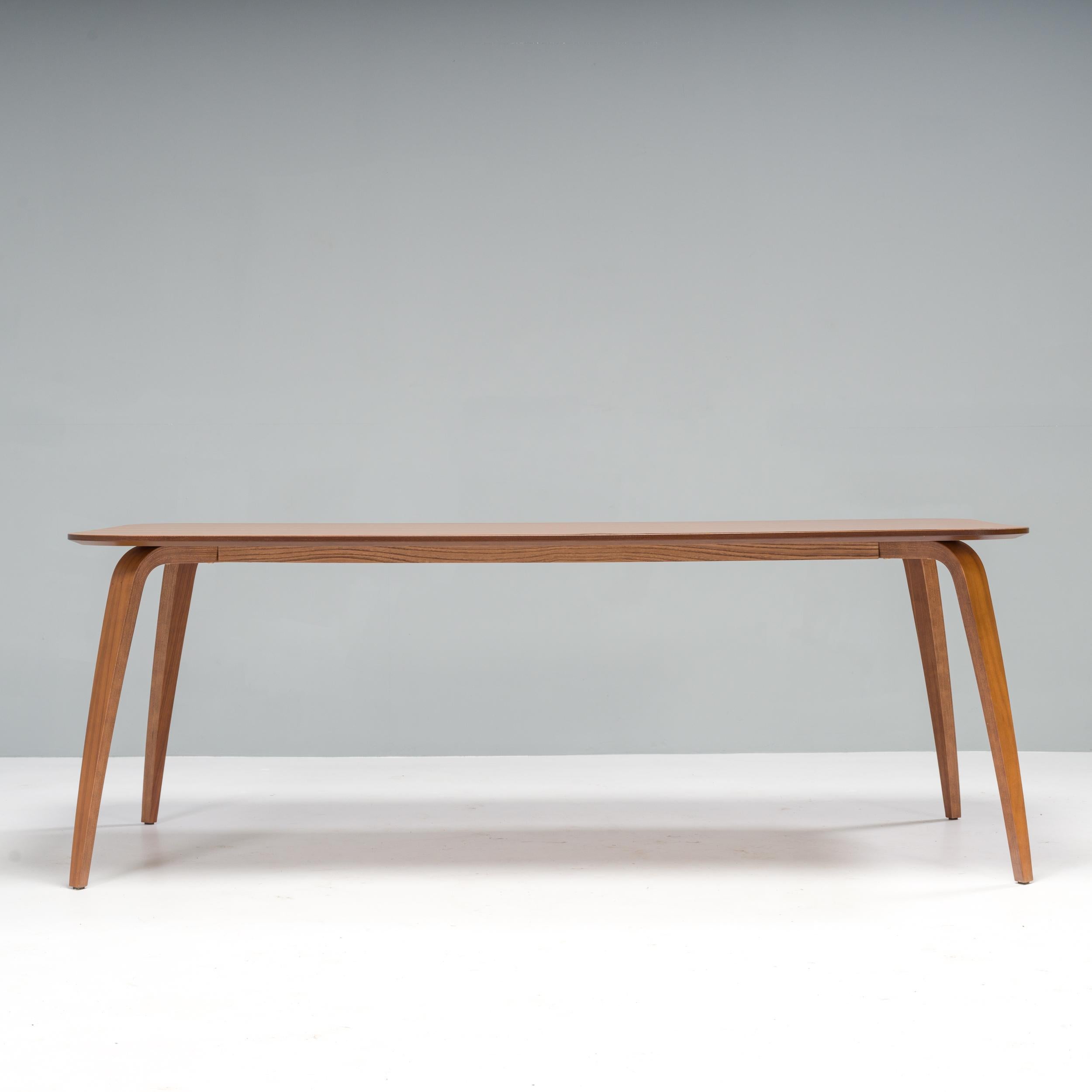 Originally designed in 2013 by Komplot Design for Gubi, the rectangular dining table is a truly classic piece.

Constructed from American walnut, the table features a large rectangular table top with softly rounded corners.

The curves of the design