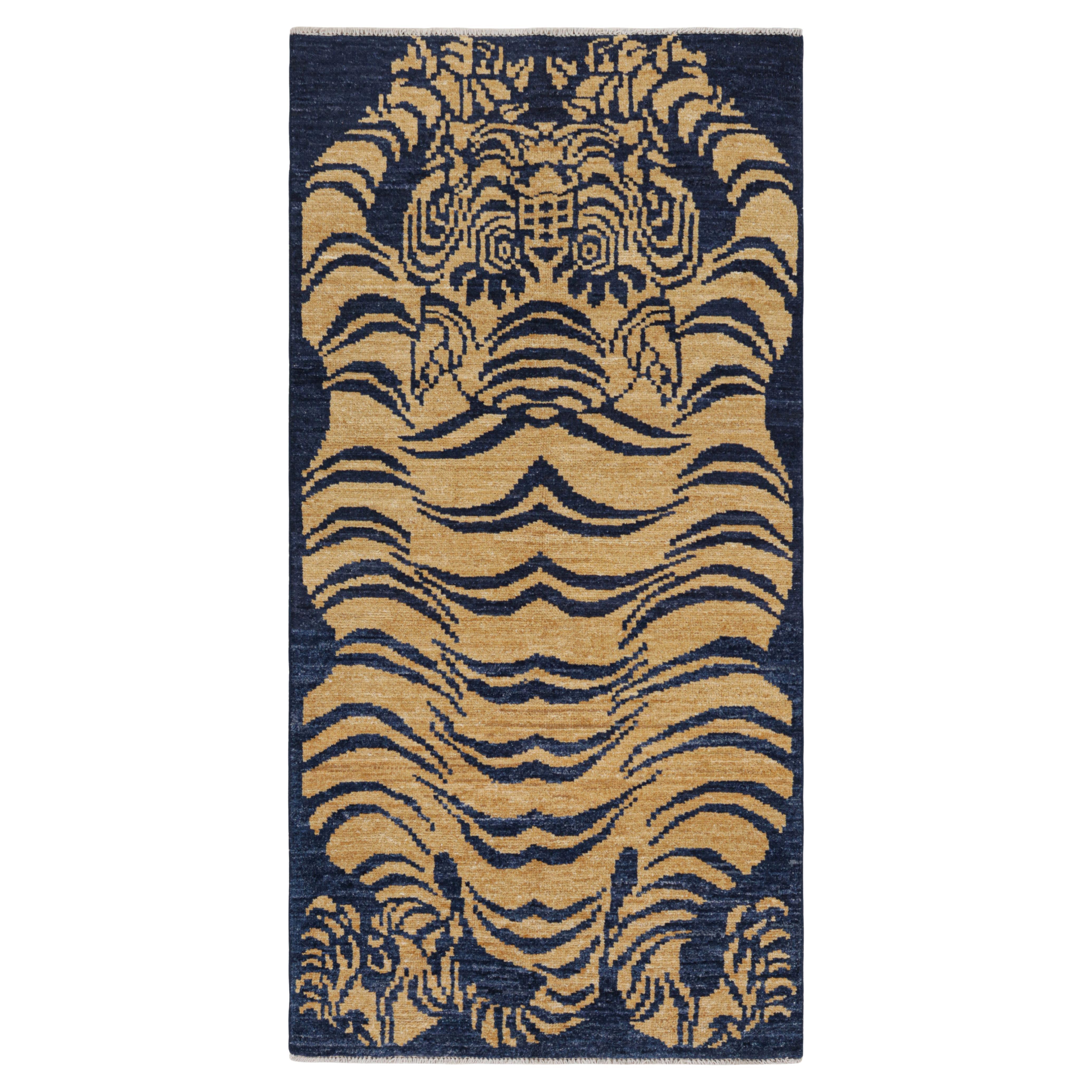 Rug & Kilim’s Contemporary Tiger Skin Runner Rug in Navy Blue & Gold Pictorial