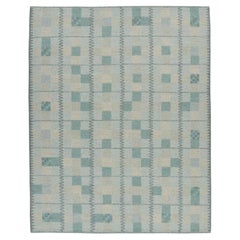 Rug & Kilim's Teppich im skandinavischen Stil in blaugrünen Tönen mit geometrischen Mustern