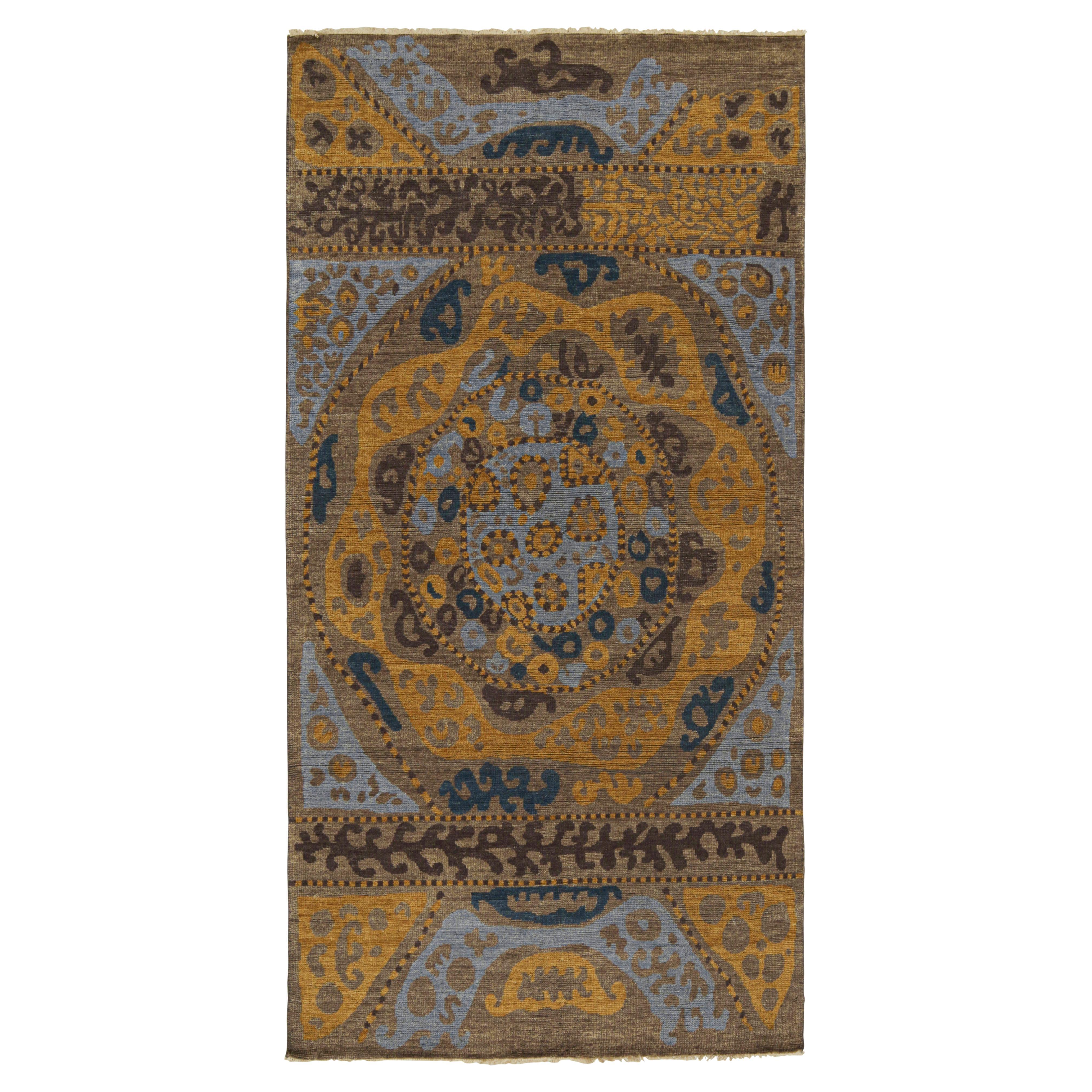 Tapis d
inspiration tribale de Rug
Kilim à motifs géométriques bleus, bruns et dorés