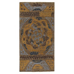 Tapis d
inspiration tribale de Rug
Kilim à motifs géométriques bleus, bruns et dorés