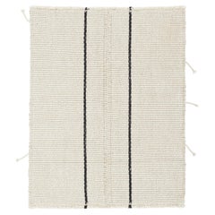 Rug 
Kilim è un kilim d
accento, con strisce nere su fondo bianco crema.