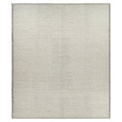Rug 
Kilim è un kilim sovradimensionato con strisce e striature testuali beige e bianche.