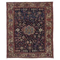 Antiker Heriz-Teppich mit farbenfrohen geometrischen Motiven und Medaillon – Teppiche & Kelims